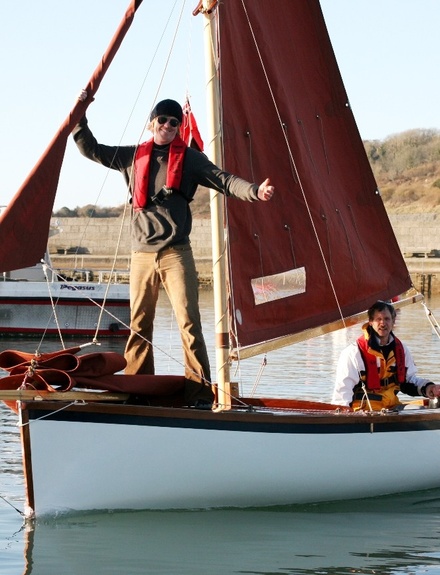 Traditional dinghy, Kisulis, brown sails, bowsprit, light winds, harbour, helm & crew, light winds
