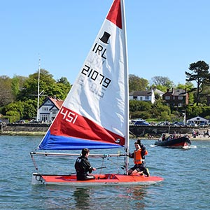 a small boat in northern Ireland with two sailors aboard