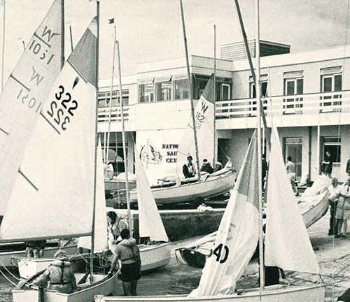 Old photo of sailing boats departing