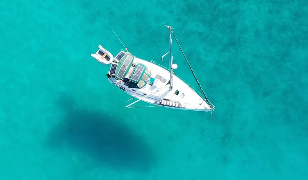 aerial shot of yacht on the blue open sea