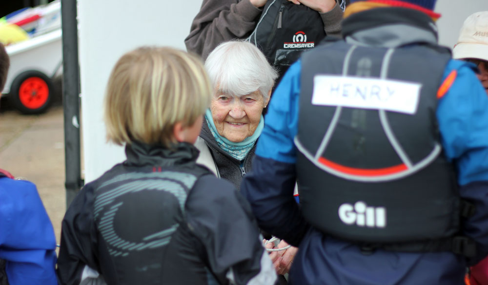 Jean at a sailing event with a group of children