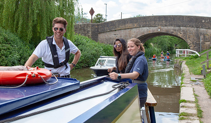 A man and two women enjoy the inland waterways
